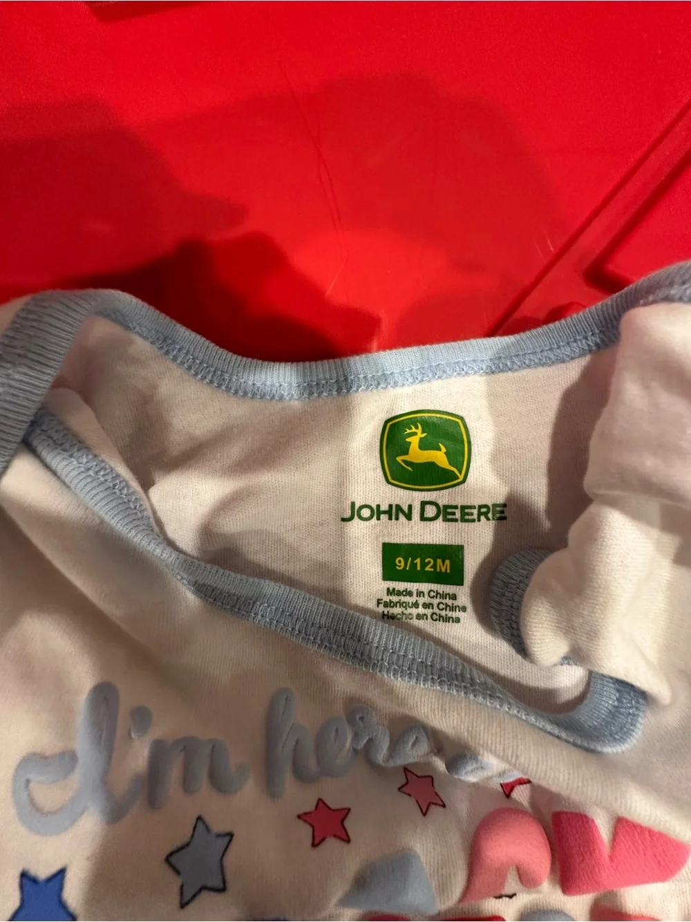 John Deere White Onesie with Light Blue Trim and Multicolor Star Graphics